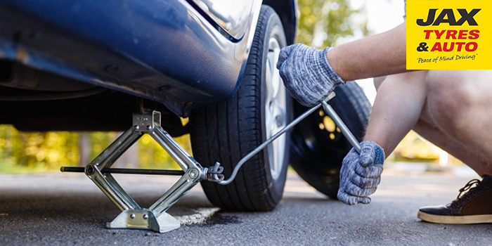 Changing car tyres - jack up the car: JAX Tyres & Auto